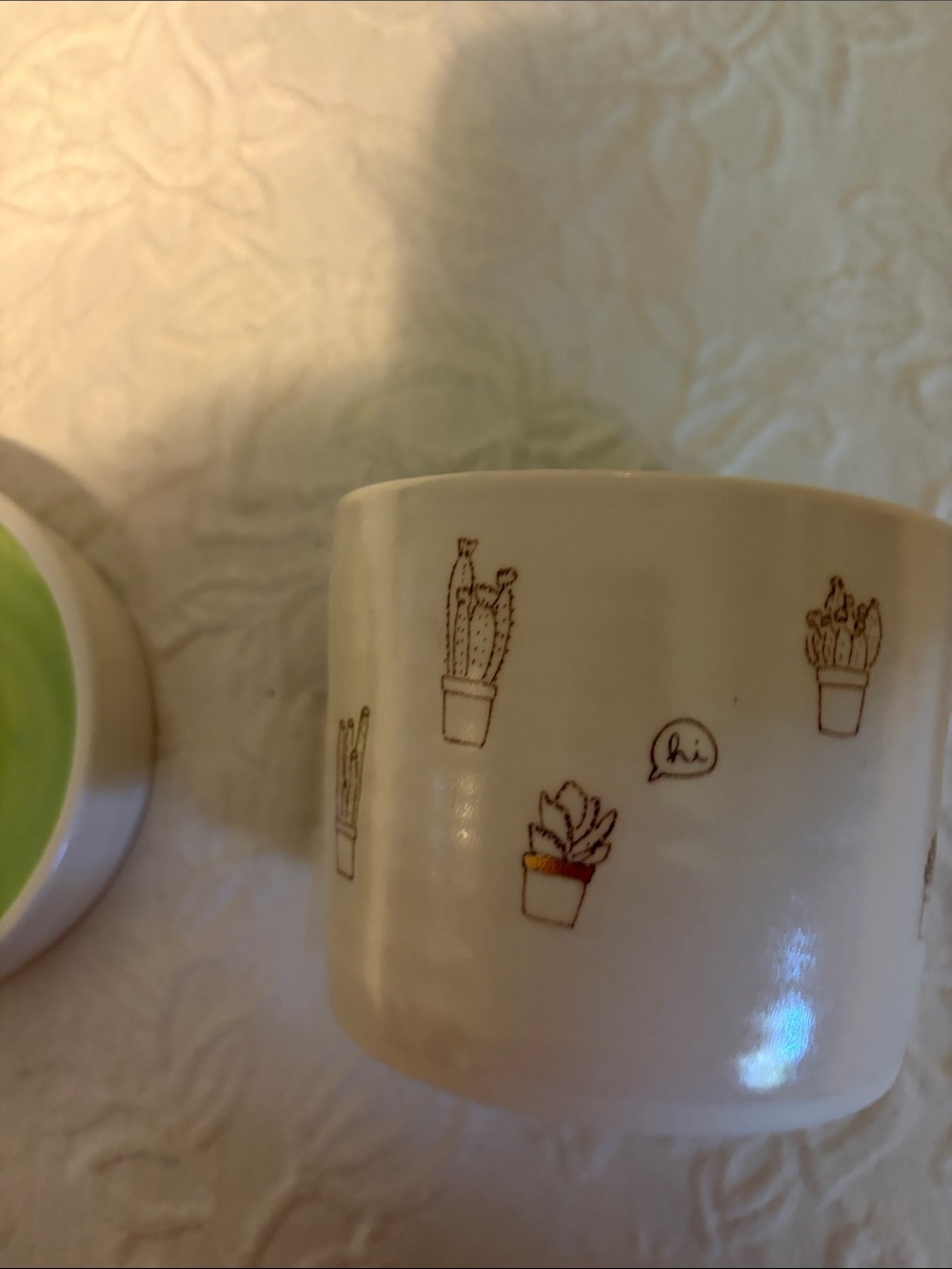 Whimsical White Ceramic Planter with Green Interior and Cactus Motif - Picture 6 of 11